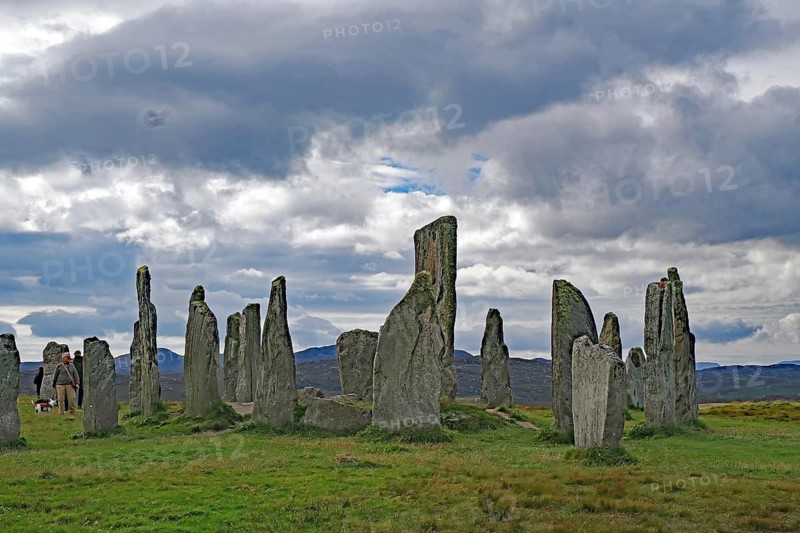 An ancient stone circle in front of gloomy clouds, a mysterious atmosphere, Standing Stones of Callanish, Outer Hebrides, Isle of Lewis, Scotland, Great Britain