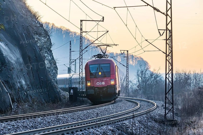 Geislinger Steige, railway line of the Filstallinie railway at dawn. Alb ascent to the Swabian Alb. InterCity of the Austrian Federal Railways ÖBB. Geislingen an der Steige, Baden-Württemberg, Germany