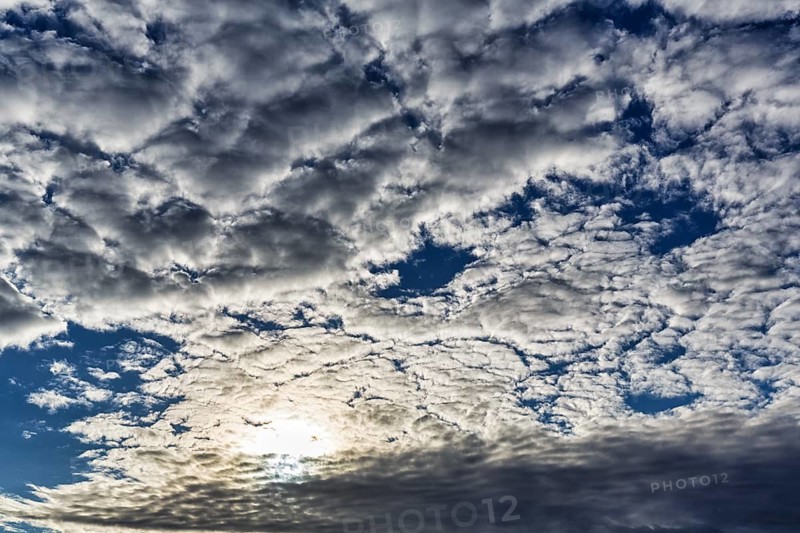Cumulus clouds, cloudy sky, sun behind cloud cover, full-frame, Rosslare, Wexford, Ireland