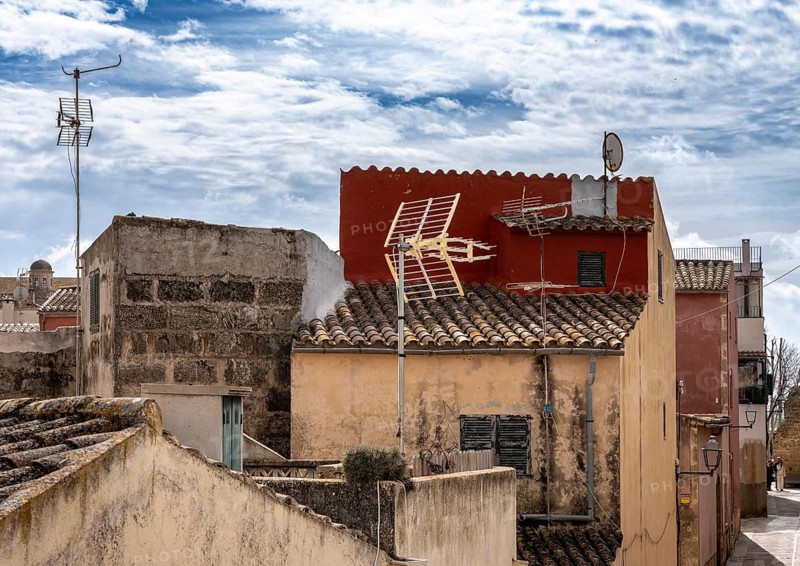View of Mediterranean houses, roofs and courtyards from the town wall, Alcudia, Majorca, Spain