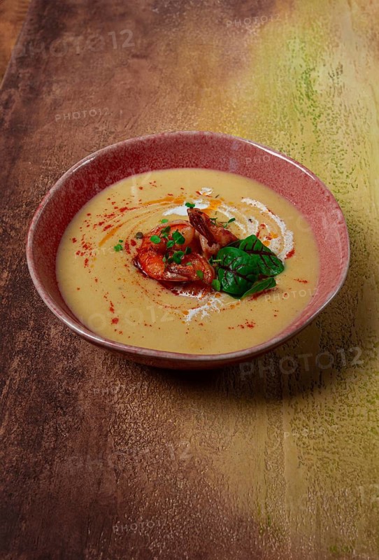 Pumpkin cream soup with shrimp, herbs and spices, homemade, no people