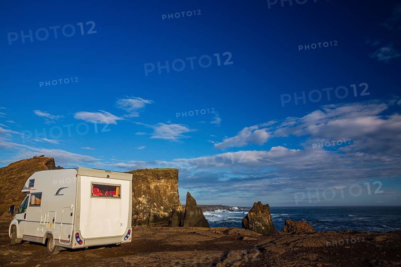 Motorhome parking on the shoreline, south of Sandvik with crashing waves. Rough nature