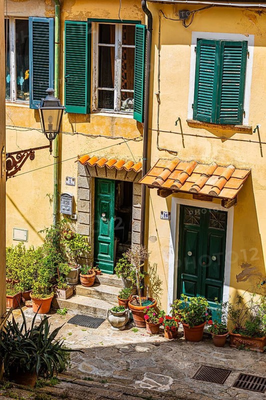 Entrances decorated with flowers, mountain village of Poggio, Elba Island, Tuscan Archipelago National Park, Tuscany, Italy