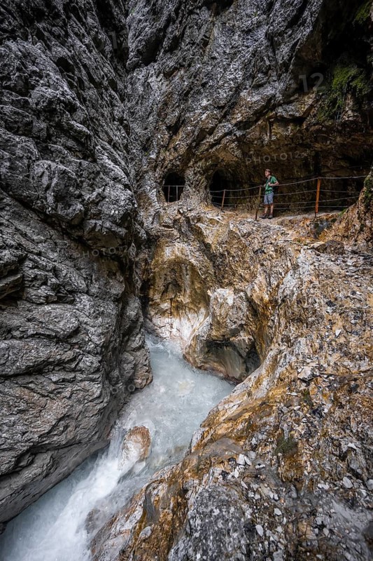 Hammersbach mountain stream in a canyon, mountaineer on a hiking trail in a gorge, Höllentalklamm, Höllental, Bavaria, Germany