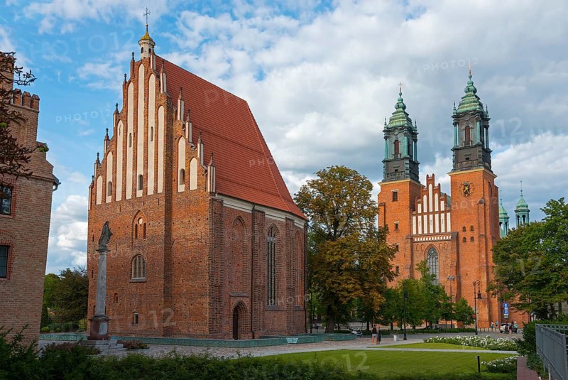 A Gothic church building with red brick facades and towers under a slightly cloudy sky, Church of the Blessed Virgin Mary in Summo and Cathedral, Cathedral Basilica of St Peter and St Paul the Apostles, Poznan, Posnan, Poznan, Wielkopolskie Voivodeship, Poland