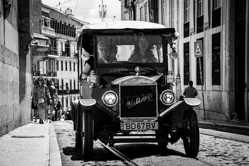 LISBON, PORTUGAL - MAY 19, 2025: Old touristic car at the street of Lisbon