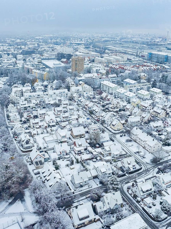 Snowy city view from the air with focus on houses and streets, Sindelfingen, Germany
