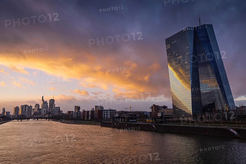 Clouds pass over the European Central Bank (ECB) and the Frankfurt banking skyline in the evening, Frankfurt am Main, Hesse, Germany