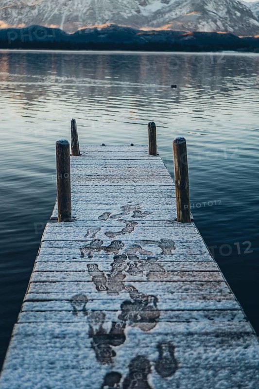 Frosty morning atmosphere during sunrise at Lake Hopfensee in the Allgäu in Bavaria, Germany