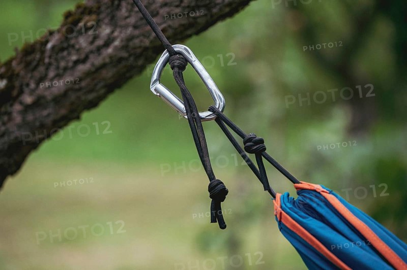Hammock attachment to a tree with rope and carabiner