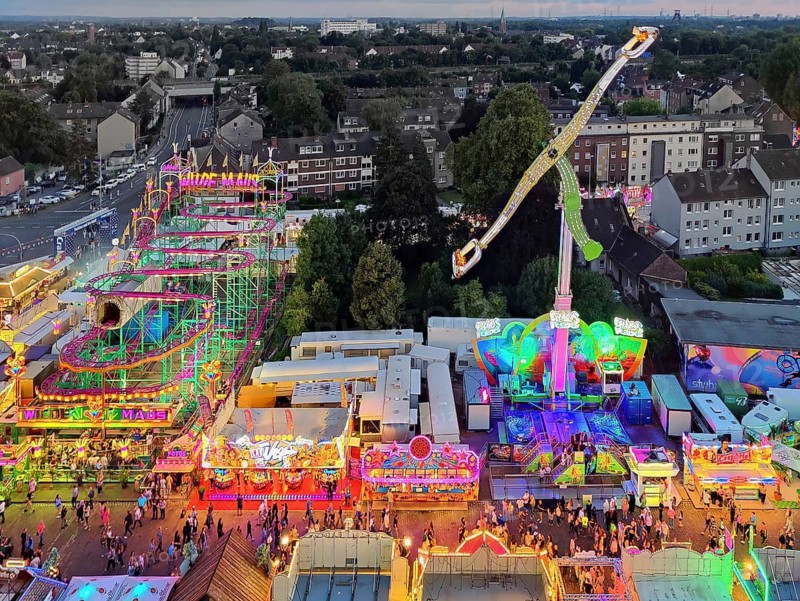 View from above from the Ferris wheel of the Cranger Kirmes in the evening and the district of the same name in Herne, Ruhr area, North Rhine-Westphalia, Germany