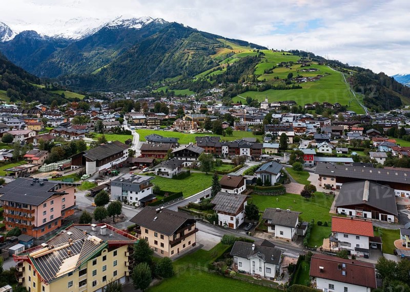 Drone image, residential buildings, view of village with parish church, Kaprun, Pinzgau, Salzburg province, Austria