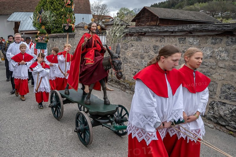 Altar servers pull the Palmesel at the Palmesel procession, Thaur, Innsbruck district, Tyrol, Austria