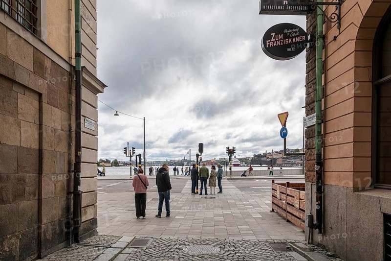 Since the old town Gamla Stan is located on an island, you can reach water at every exit, a view of the Baltic Sea through the alley, shipping docks and other districts, Stockholm, Sweden