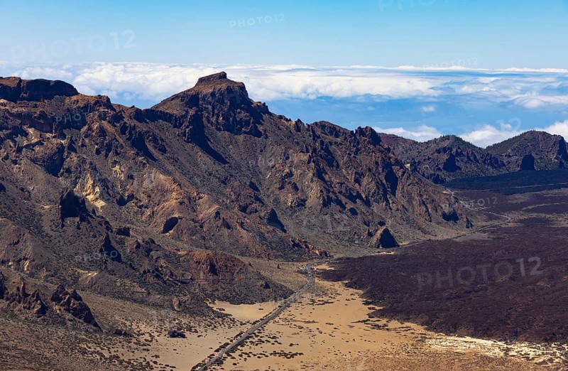 Mountain hiking, view from the summit of Montana Guajara onto the road through the Teide National Park, view of El Sombrero mountain, Tenerife, Canary Islands, Spain