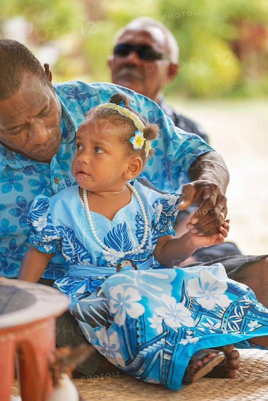 Family at village ceremony, Yasawa islands, Fiji