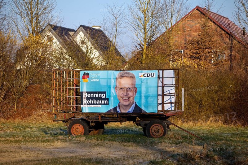 Large poster for the Bundestag election 2025 with the direct candidate from the CDU Henning Rehbaum on a tractor trailer, Ahlen, Münsterland, Germany