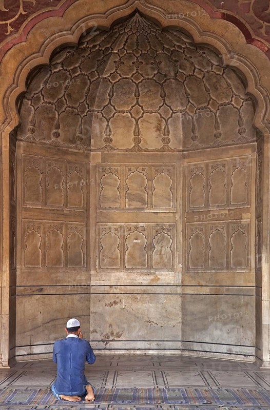 Muslim praying in the prayer area inside the Masjid-i Jah?n-Num?, Jama Masjid mosque in Old Delhi, India