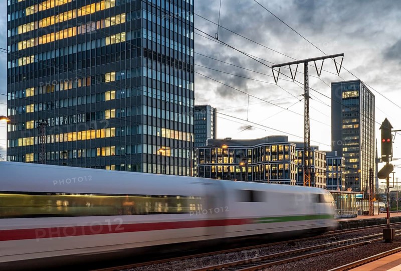 Railway station, ICE train on platform, skyline of Essen city centre, North Rhine-Westphalia, Germany