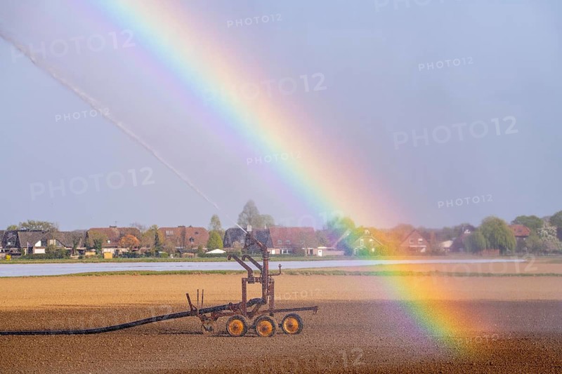 Artificial irrigation of a field, freshly sown, in April, with a sprinkler system, long dry spell in spring makes this necessary for the young plants to grow well, near Kerken, Lower Rhine, North Rhine-Westphalia, Germany