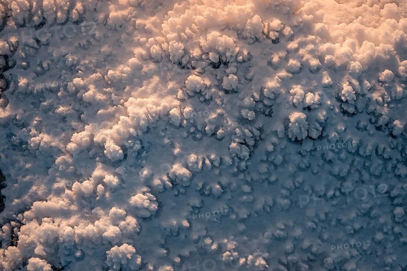 Close-up of snow textures at Siete Picos in Guadarrama Mountains, Madrid, capturing the intricate patterns formed by snow crystals in a pristine winter setting