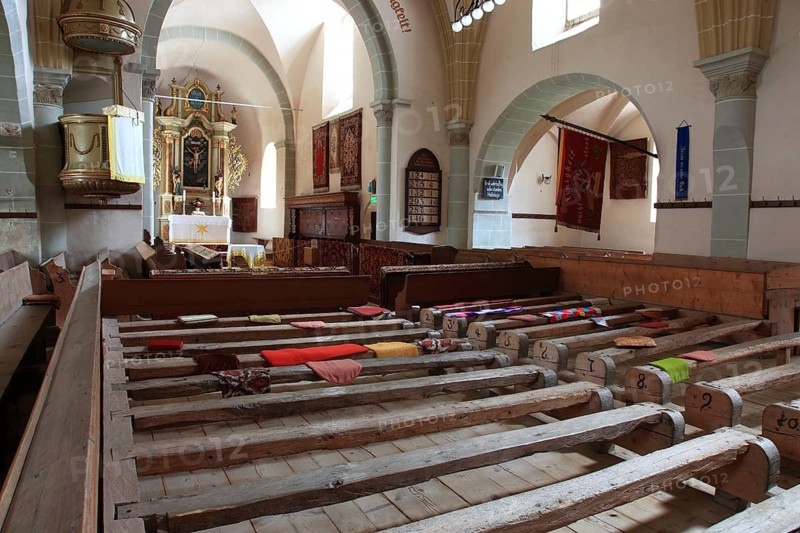 Pews, interior of the fortified church in Honigberg, Harman, Burzenland in Transylvania, Romania