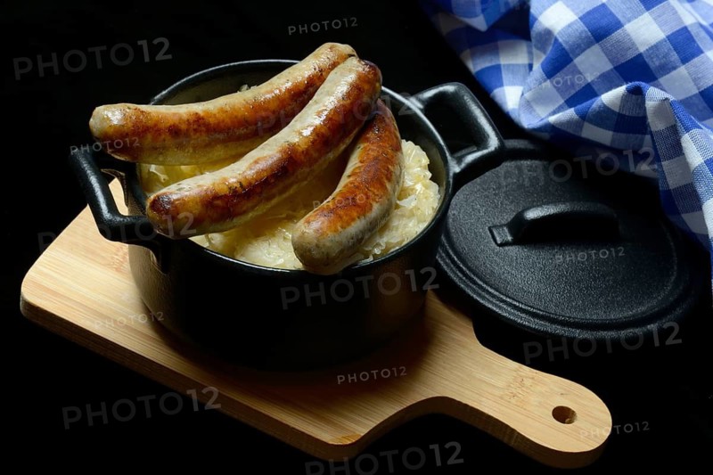 Nuremberg sausages with sauerkraut in a pot, Rostbratwurst, Germany