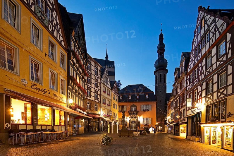 Market square with town hall, half-timbered houses and tower of the parish church of St. Martin in the evening, Rhineland-Palatinate, Germany