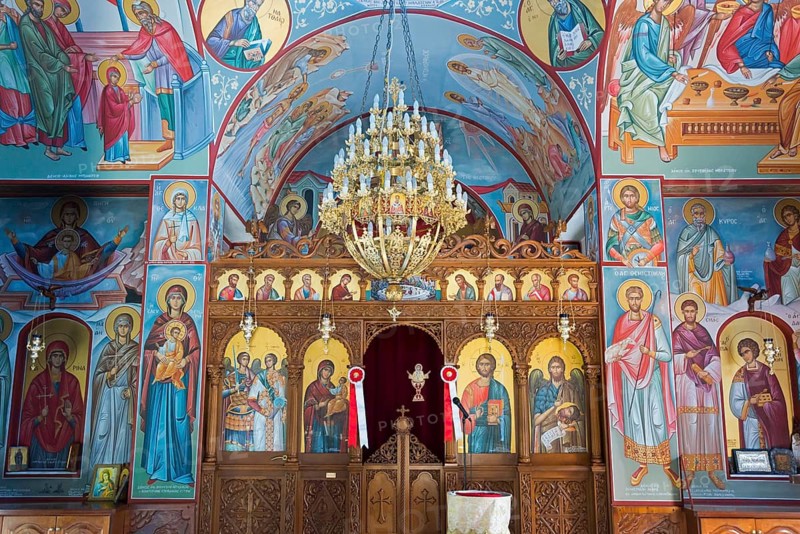 Interior view of an Orthodox church with icons and a large golden chandelier, Church of the Dormition of the Virgin Mary, Panagia Thalassini, Stomio, Thessaly, Greece