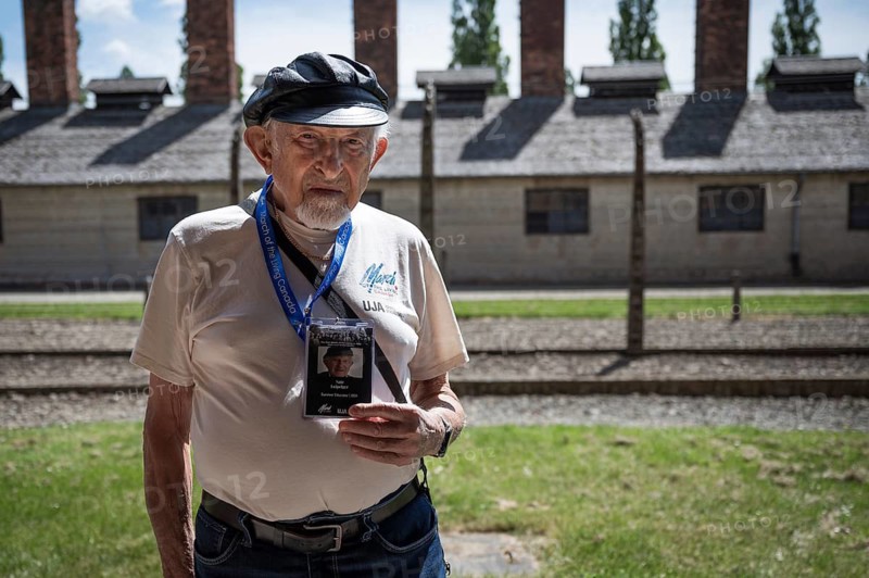 OSWIECIM, POLAND - MAY 6, 2024: March of the Living on the site of the former Auschwitz Birkenau concentration camp. Portrait of Nate Leipciger survivor prisoner of the camp