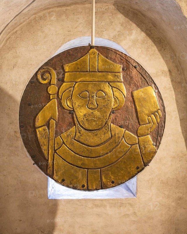 Fire-gilded Romanesque copper disc with the relief portrait of Saint Conrad of Constance, represented with episcopal staff and book of gospels, from the crypt of Constance Cathedral, Constance, district of Constance, Baden-Württemberg, Germany