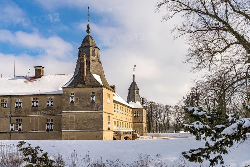 The snow-covered Westerwinkel Castle in winter, Herbern, Ascheberg, Münsterland, North Rhine-Westphalia, Germany