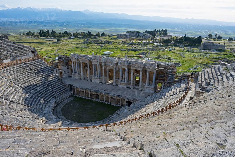 View of an ancient theatre in a green landscape with mountains in the background, amphitheatre, Hierapolis, Pamukkale, Denizli, UNESCO World Heritage Site, Anatolia, Turkey