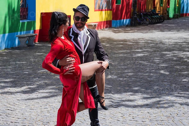Argentina, Buenos Aires, January 20, 2025: Buenos Aires, Colorful buildings of El Caminito. Tango show, performers and street dancers