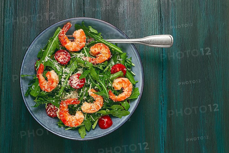 Shrimp salad with arugula and cherry tomatoes, with parmesan cheese, healthy food