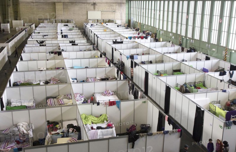 Temporary rooms with beds are set up in an emergency shelter for refugees on 9 December 2015 in a former hangar at Tempelhof Airport, Berlin, Berlin, Germany