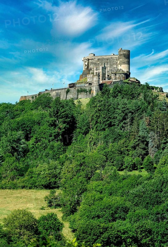 Murol castle built on a basalt promontory in the 13th century. Auvergne Volcanoes Natural Park. Puy de Dome department, Auvergne Rhone Alpes. France
