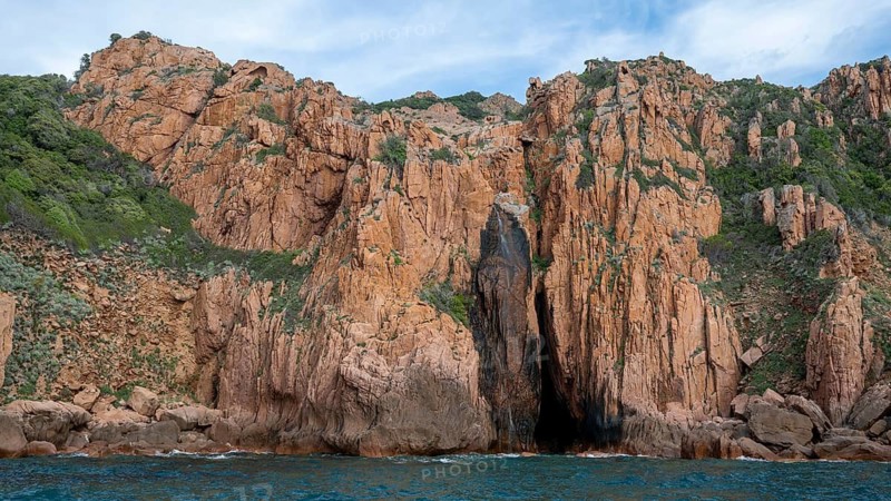 Rock formations and deep blue water, Capo Rosso, Gulf of Porto, Corsica, Corsica, France