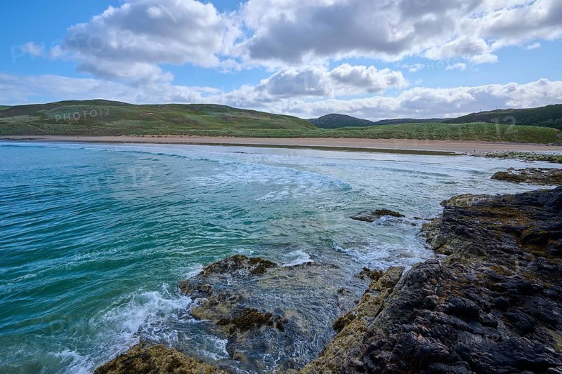 Rocky coastal landscape with soft waves and cloudy sky, Farr Bay, Bettyhill, Thurso, Scotland, United Kingdom, Great Britain