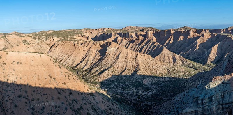 Wide hilly desert landscape with dry vegetation, Gorafe desert, semi-desert, Granada, Andalusia, Spain
