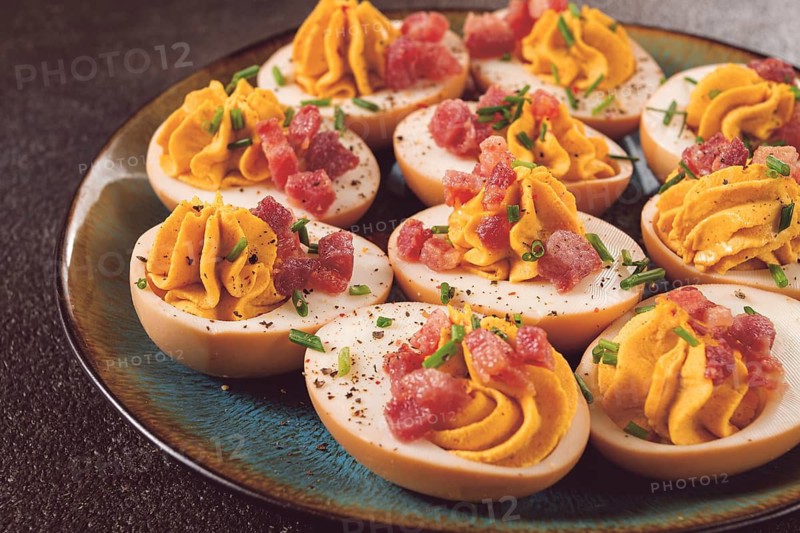 Spicy, stuffed ramen eggs, with bacon and green onions, homemade, no people