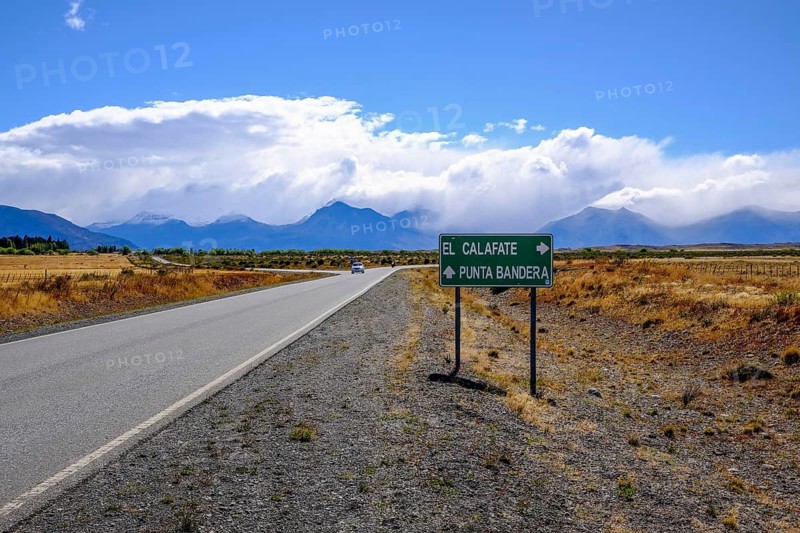 El Calafate, Patagonia, Argentina, R11 country road with little traffic in front of a mountain landscape, the Andes. Turn-off to Punta Bandera