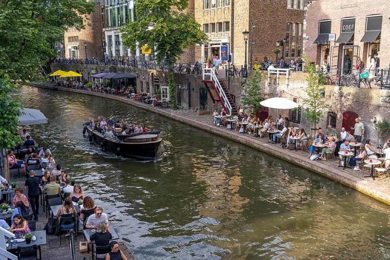 The old town centre of Utrecht, Oudegracht, around 2 km long with many old houses, shops, restaurants directly on the canal, many bridges, boat traffic of all kinds, canal cruise, Netherlands