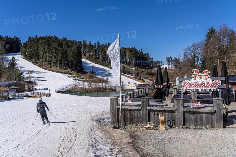 Winter sports area in the Sauerland, Winterberg ski lift carousel, artificial snow slopes, artificial snow from over 360 snow guns, Quick Jet ski area, 12 of 24 lifts are in operation in mid-March, the rest of the landscape is snow-free, North Rhine-Westphalia, Germany