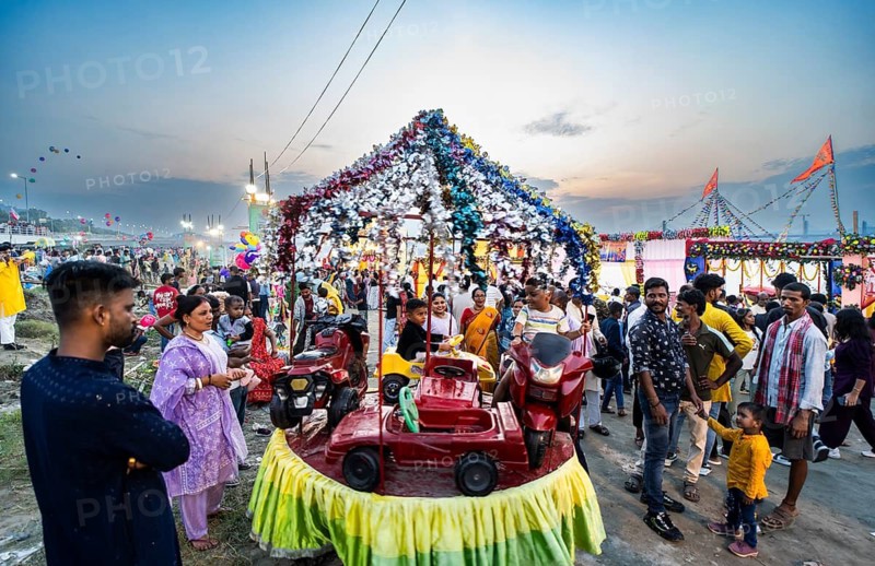 Hindu devotees gather on the banks of the Brahmaputra River to offer prayers to the Sun God on the occasion of Chhath Puja, in Guwahati, India on 27 October 2025