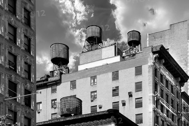 Wooden water storage tanks on the roof of a high-rise building, New York City, USA