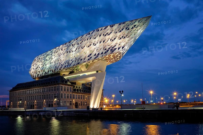 ANTWERP, BELGIUM, MAY 27, 2018: Port authority house (Porthuis) designed by famous Zaha Hadid Architects which was her last project illuminated in the night