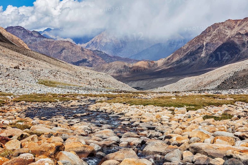 Mountain stream in Himalayas near Kardung La pass. Ladakh, India