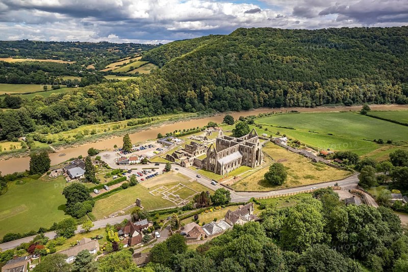 The ruins of Tintern Abbey and the Wye Valley landscape seen from the air, Tintern, Monmouth, Wales, United Kingdom