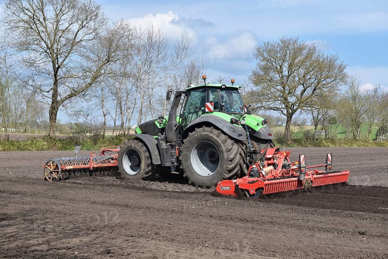 Tractor with harrows, disc harrows during tillage